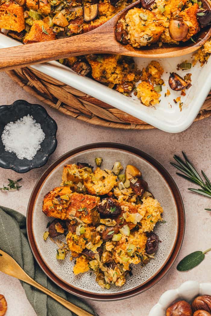 A small plate with a serving of stuffing made with cornbread.