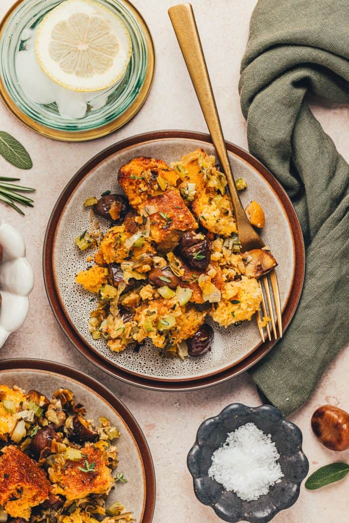 A small plate with a serving of stuffing made with cornbread.