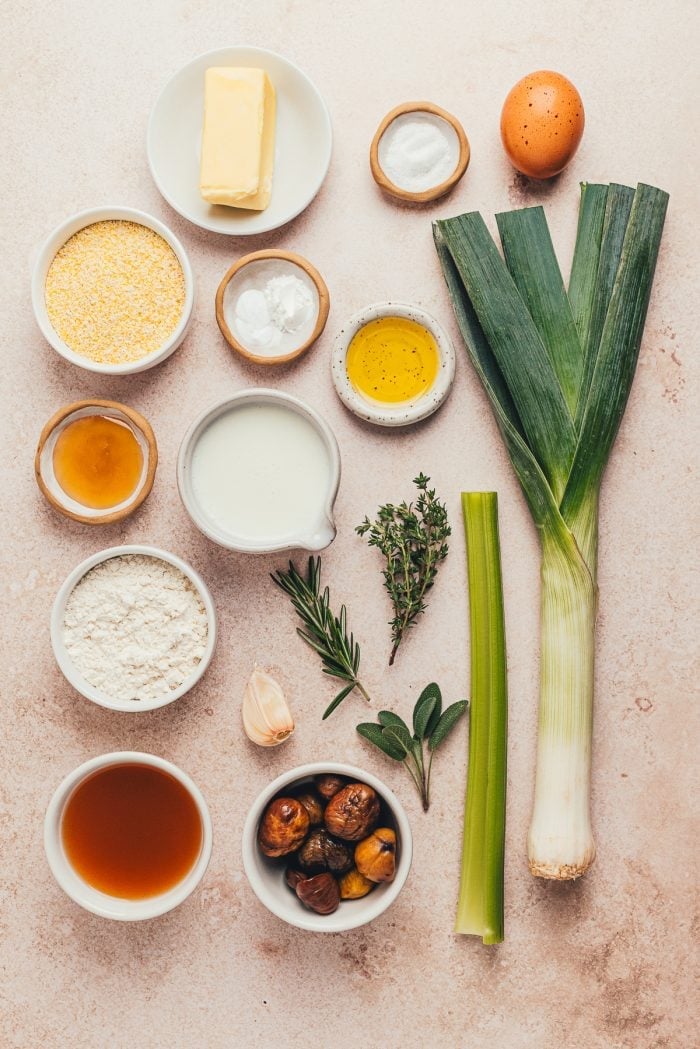 Various bowls of ingredients to make corn bread stuffing with leeks.