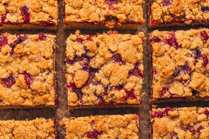 A view of the top of the cranberry crumb cake slices showing the streusel topping. 