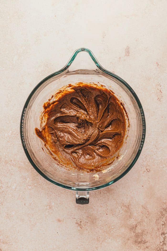 The wet ingredients mixed together in a glass bowl.