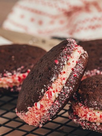Three chocolate Whoopie pies with crushed peppermint candy.