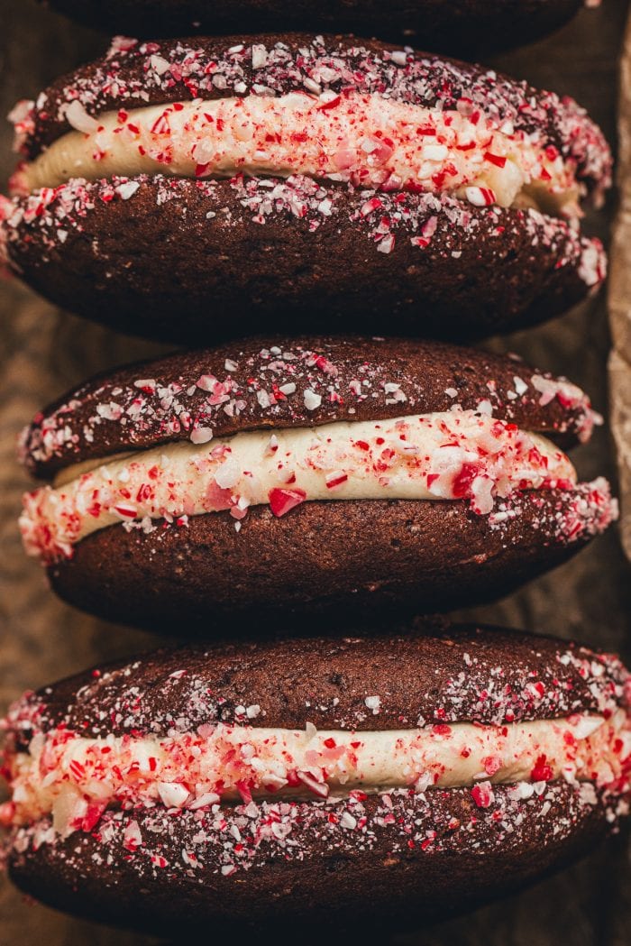 Three chocolate Whoopie pies with crushed peppermint candy.