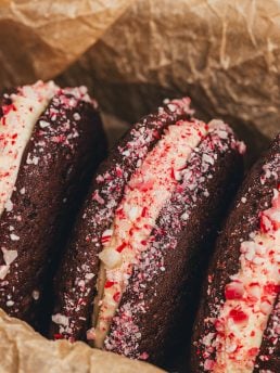 Three chocolate Whoopie pies with crushed peppermint candy.