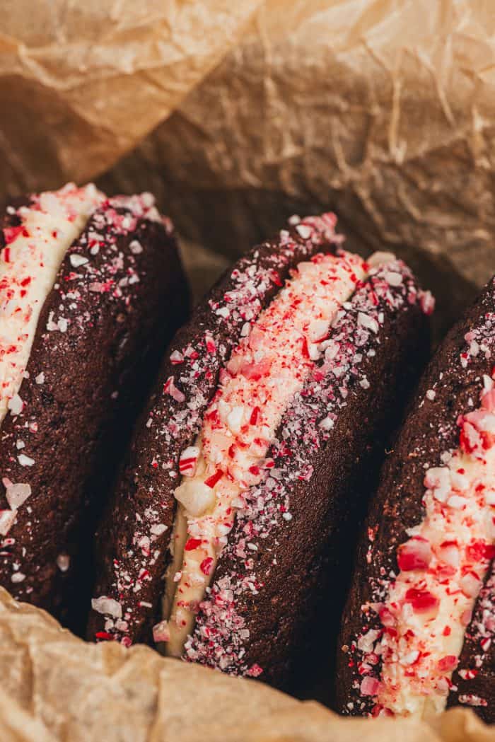 Three chocolate Whoopie pies with crushed peppermint candy.