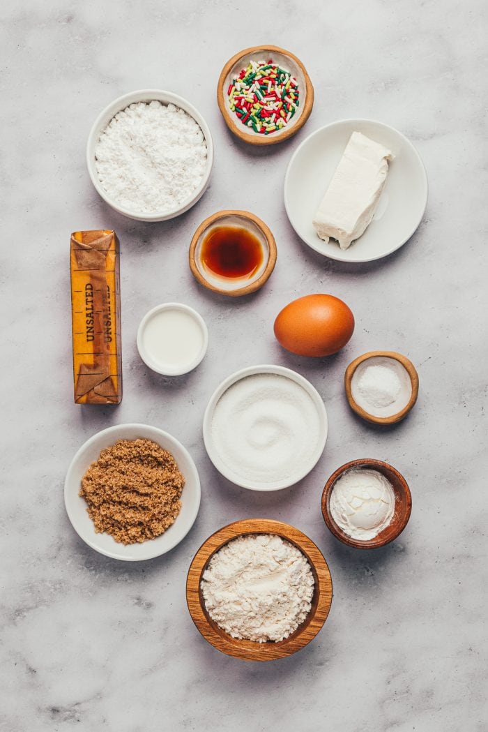 Various bowls with ingredients used to make sugar cookie bars.