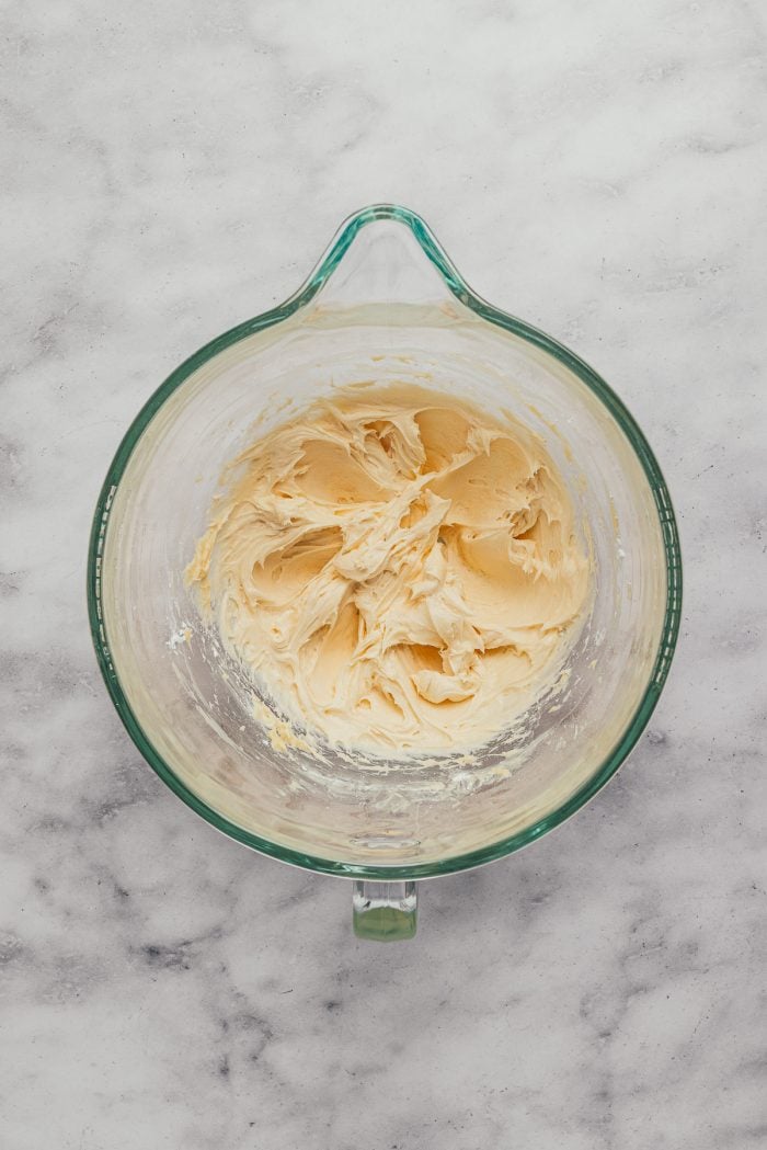 The mixed batter in a glass mixing bowl.