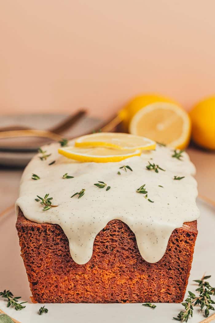 A platter with a loaf of lemon pound cake.