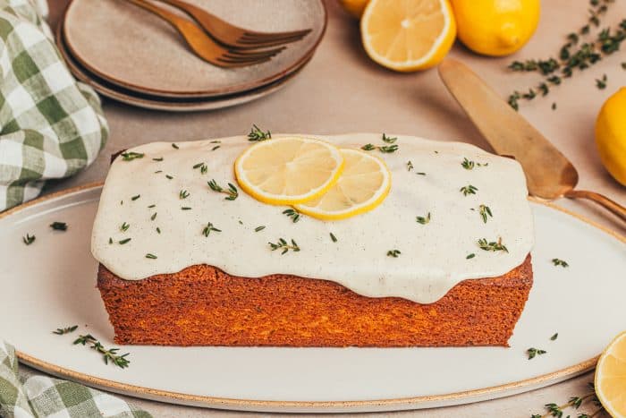 A lemon Thyme cake loaf on a platter.