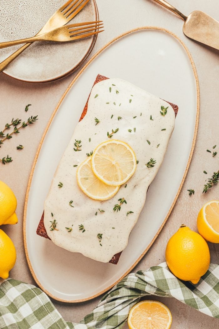 A platter with a loaf of lemon pound cake.