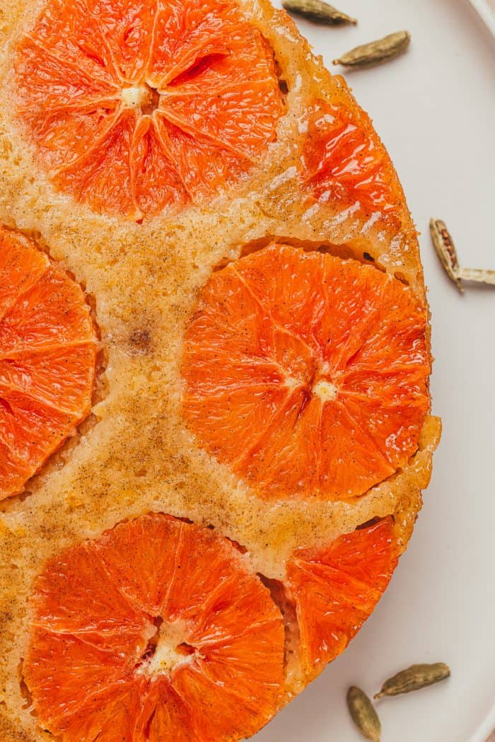 A closeup image of half of the orange upside down cake showing the sliced oranges.