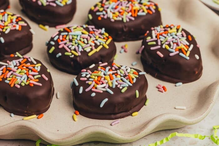 A few homemade chocolate Easter eggs scattered on a plate.