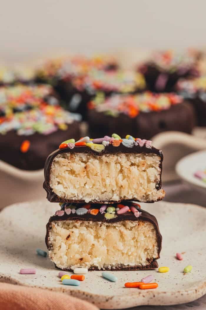 A homemade chocolate Easter egg is split in half on a small plate.