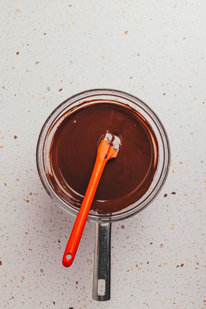 The chocolate coating mixture melted in a saucepan.