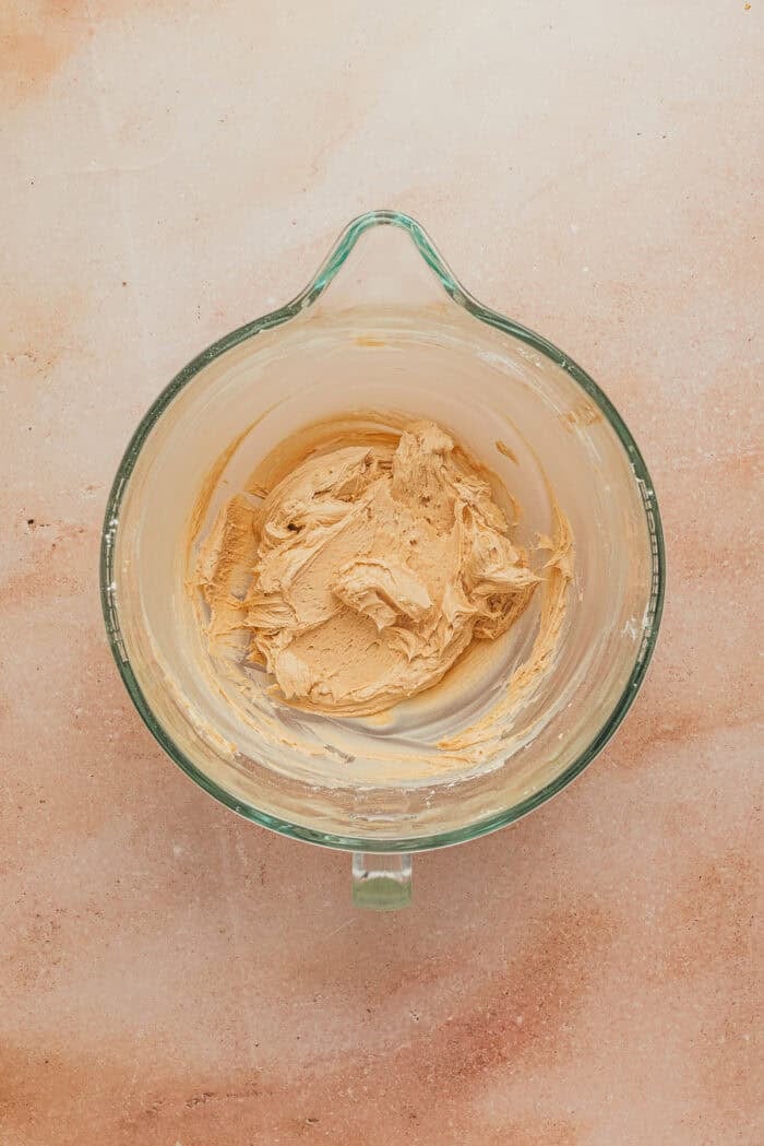 A glass bowl with the espresso buttercream frosting.