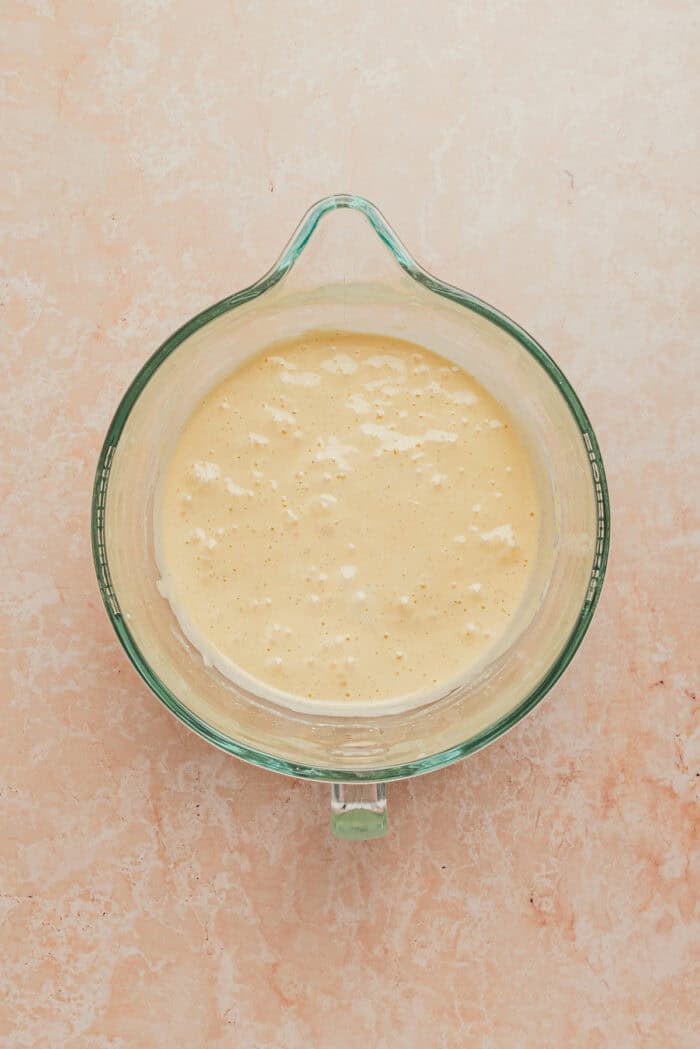 A mixing bowl with the cake batter for tres leches cake.