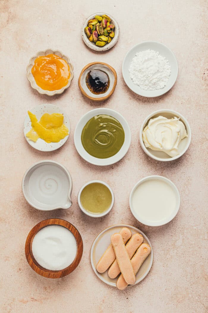The ingredients used to make lemon pistachio tiramisu in various bowls.
