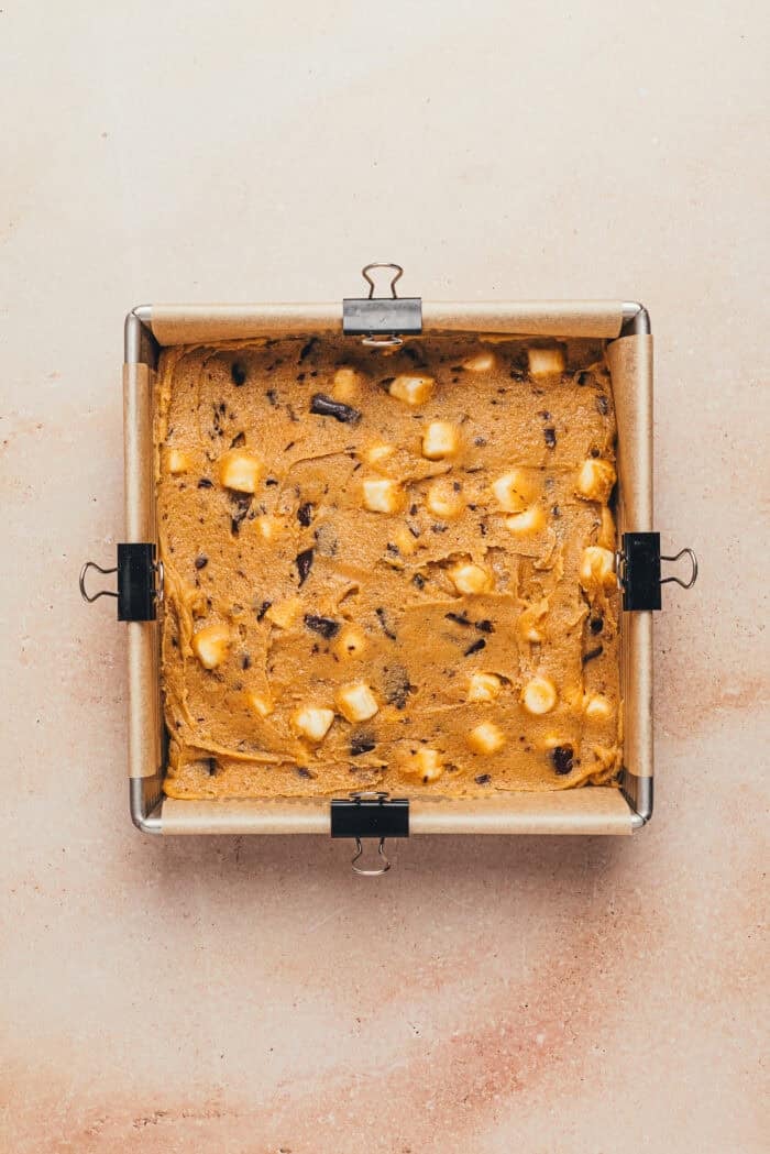 A square baking pan with the batter spread in it.