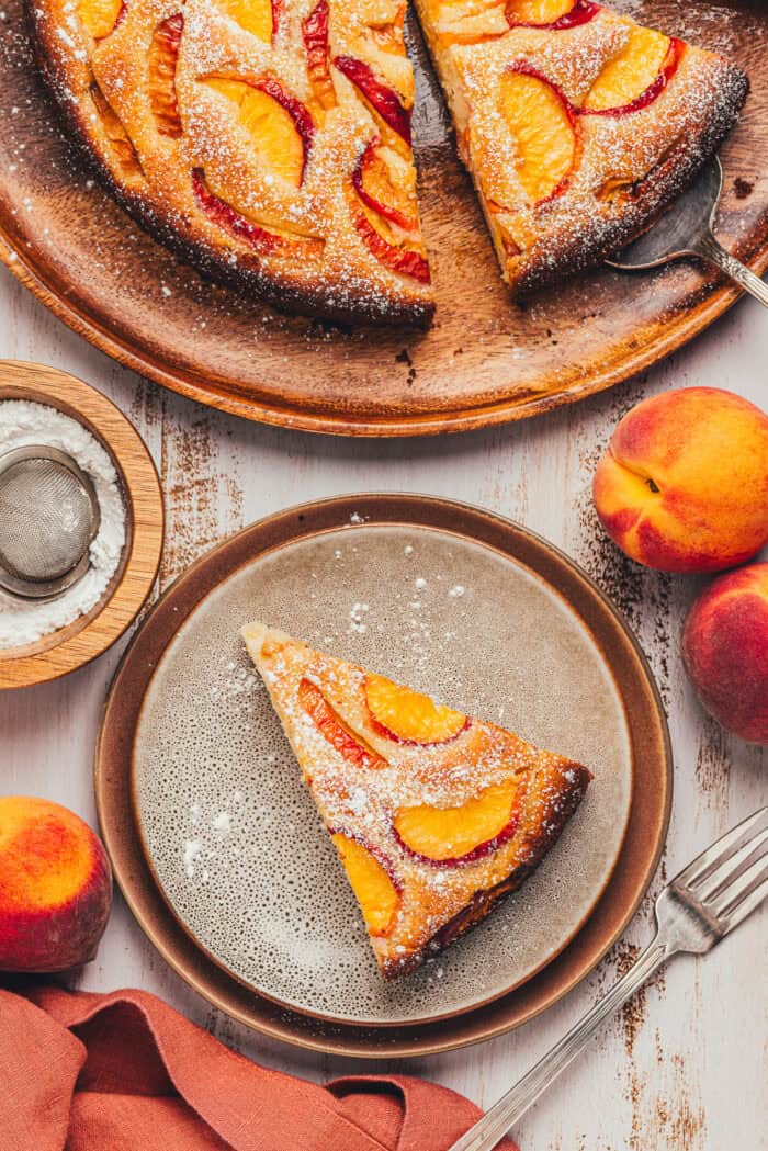 A slice of peach snack cake on a plate.