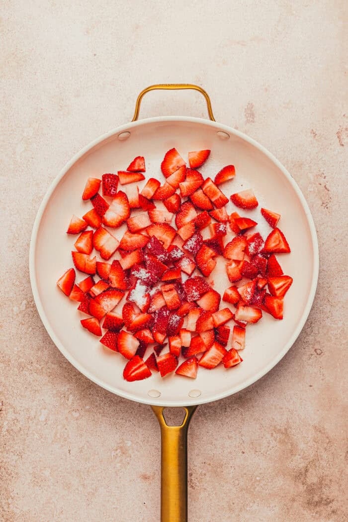 Fresh chopped strawberries in a pan.