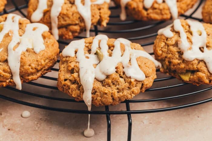 Apple oatmeal cookies on a cooling rack.