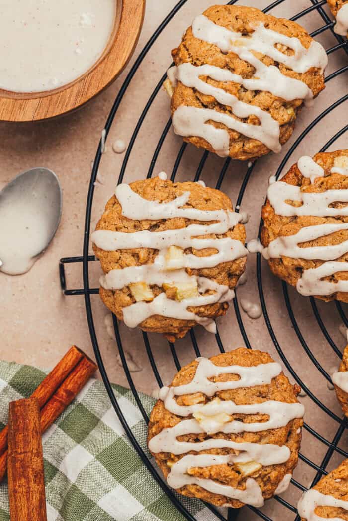 Cinnamon apple oatmeal cookies on a cooling rack.
