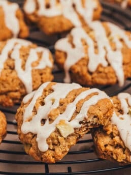 Cinnamon apple oatmeal cookies on a cooling rack.
