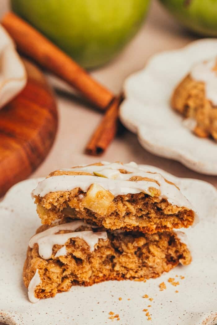 A plate with an apple oatmeal cookie split in half.