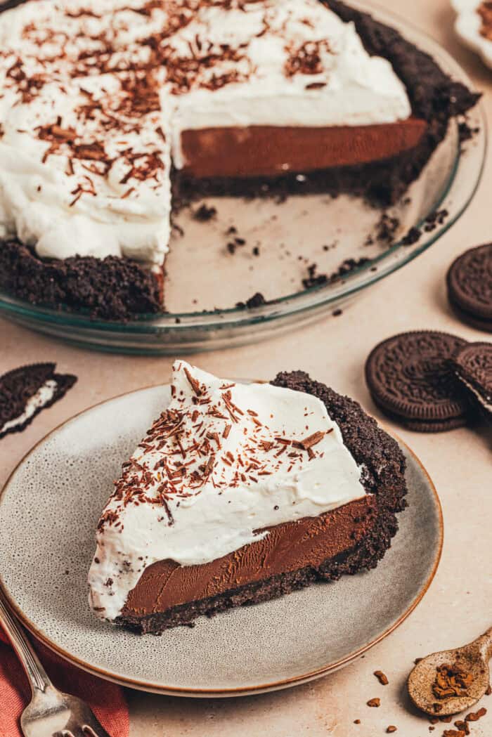A no bake chocolate espresso pie with a slice of the pie on a small plate.