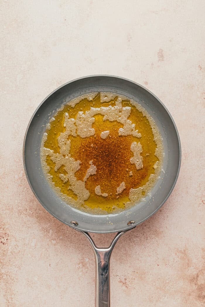 melted butter in a bowl for brown butter chai snickerdoodle cookies