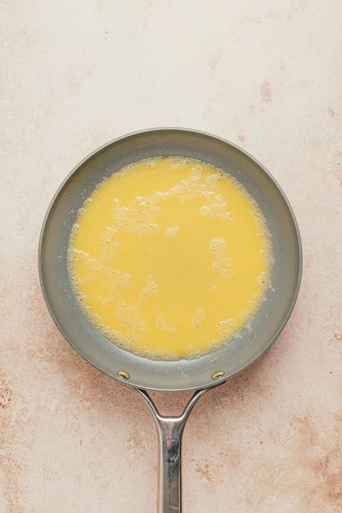 melted butter in a bowl for brown butter chai snickerdoodle cookies