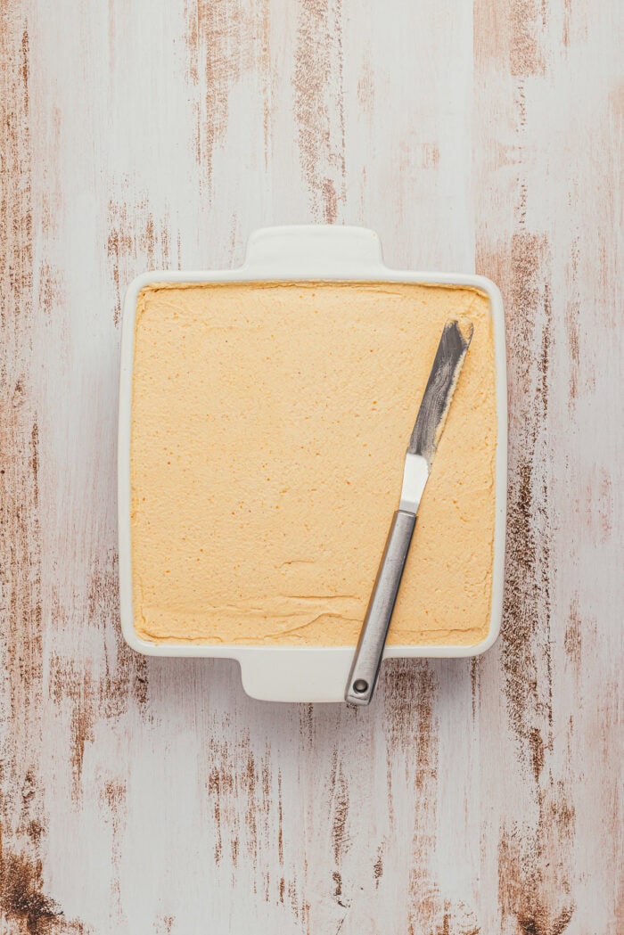 Chai-dipped ladyfingers topped with pumpkin cream in an 8-inch square dish