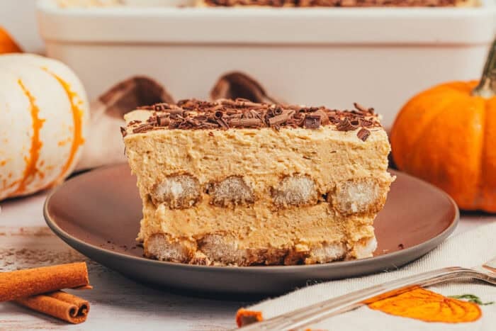 a slice of pumpkin tiramisu in a brown plate