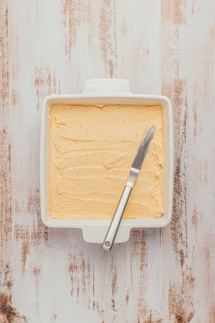 Chai-dipped ladyfingers topped with pumpkin cream in an 8-inch square dish