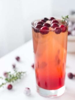 Refreshing Cranberry Thyme Sparklers made bubbly with 7UP or Ginger Ale make for a simple and easy holiday cocktail.